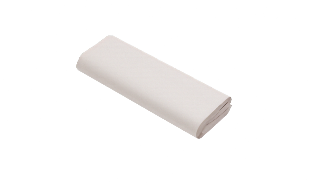 Bundled stack of white packing paper, not bundled with strapping. Pictured on a plain white background.