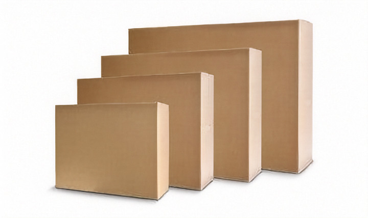Four plain brown cardboard tv moving boxes of different sizes arranged in a staggered row on a white background.