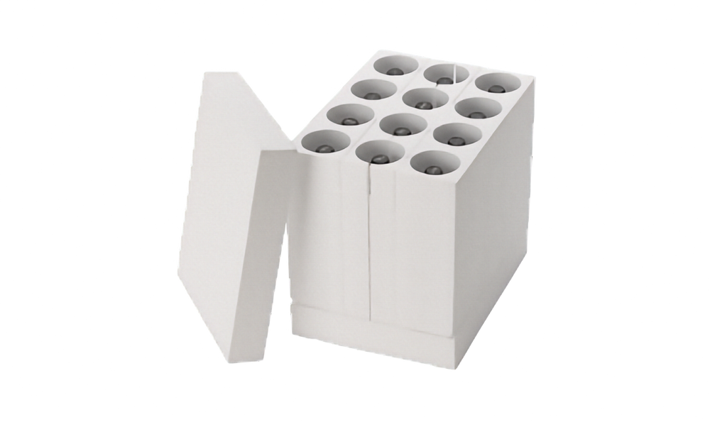 A white polystyrene insert for safely packing and storing wine bottles, made to go into a book and wine box, has a white lid leaning against it with wine bottles inside to show an example of how it can be packed. Shown open on a plain white background.
